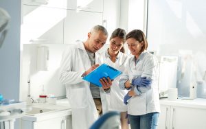 Orthodontist sharing strategies to grow his practice with his team.